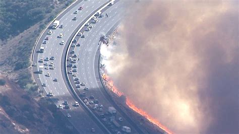 Fire breaks out along I-8 in Mission Valley